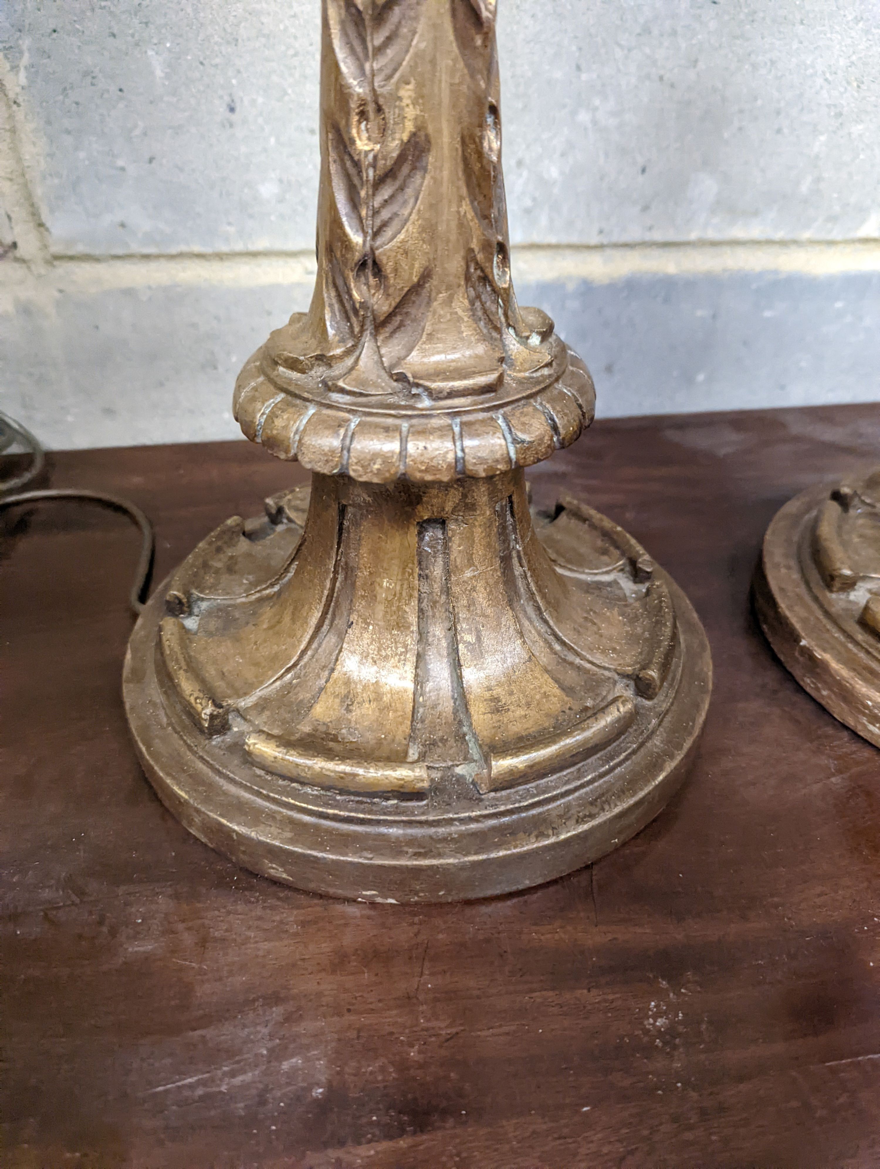 A pair of 1920's Italian gilt wood painted carved table lamps, height 60cm